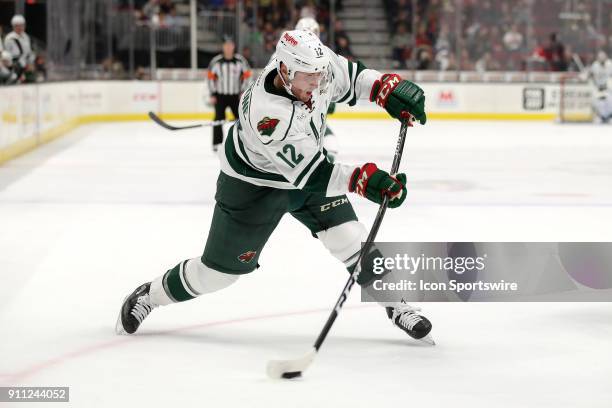 Iowa Wild center Pat Cannone shoots the puck during the first period of the American Hockey League game between the Iowa Wild and Cleveland Monsters...