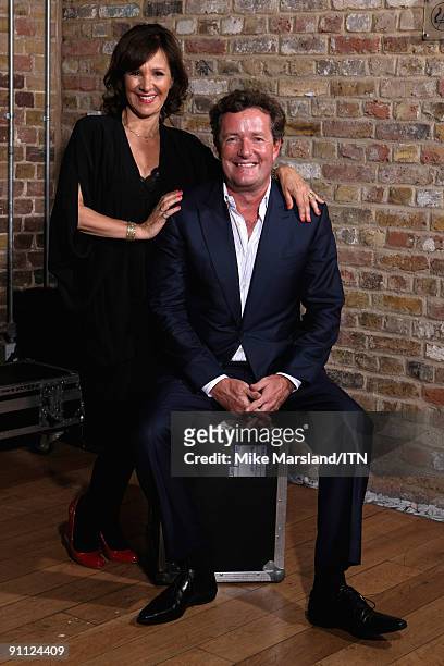 Arlene Phillips and Piers Morgan pose ahead of the performance at the "Newsroom's Got Talent" event held in aid of Leonard Cheshire Disability and...