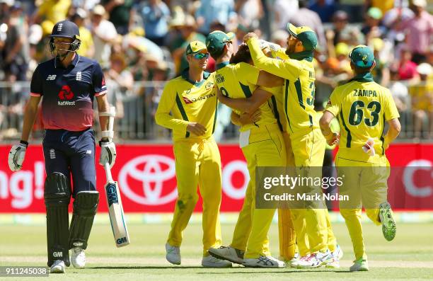 Andrew Tye of Australia celebrates getting the final wicket with team mates during game five of the One Day International match between Australia and...