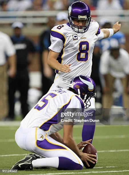 Kicker Ryan Longwell of the Minnesota Vikings kicks from the hold of Chris Kluwe of the Detroit Lions at Ford Field on September 20, 2009 in Detroit,...