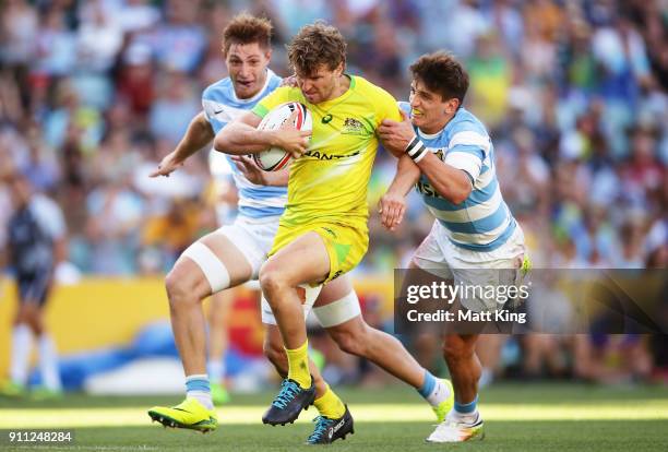 Lewis Holland of Australia takes on the defence in the semi final match against Argentina during day three of the 2018 Sydney Sevens at Allianz...