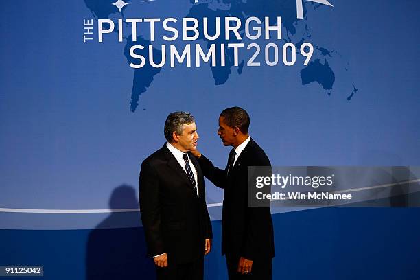 President Barack Obama greets British Prime Minister Gordon Brown at the welcoming dinner for G-20 leaders at the Phipps Conservatory on September...