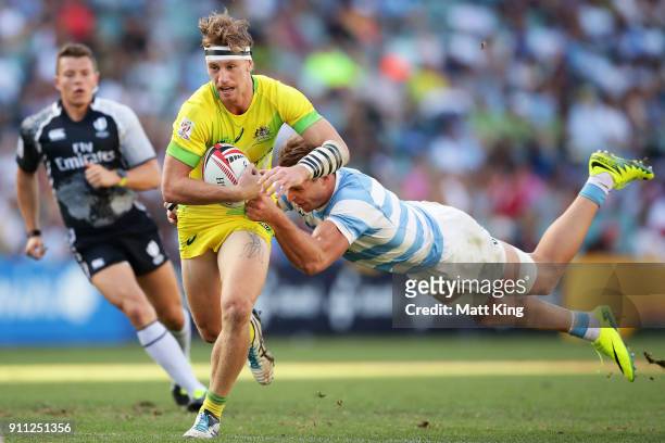 Ben O'Donnell of Australia takes on the defence in the semi final match against Argentina during day three of the 2018 Sydney Sevens at Allianz...