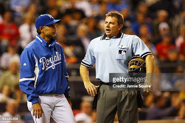 Home plate umpire Greg Gibson exchanges words with Manager Trey Hillman of the Kansas City Royals prior to ejecting him during the 4th inning of the...