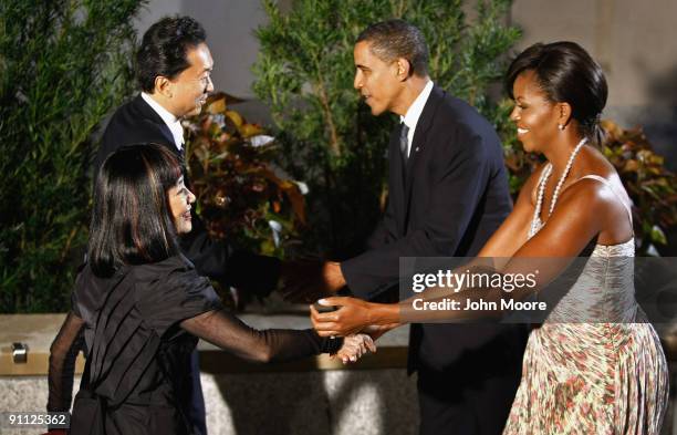 President Barack Obama and first lady Michelle Obama greet Japanese Prime Minister Yukio Hatoyama and first lady Miyuki Hatoyama at the Phipps...