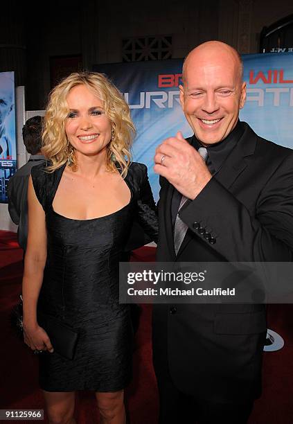 Radha Mitchell and Bruce Willis arrive on the red carpet at the Los Angeles premiere of "Surrogates" at the El Capitan Theatre on September 24, 2009...