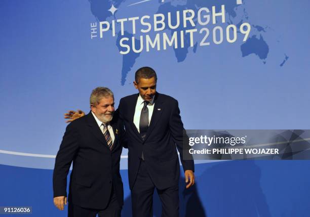 President Barack Obama greets Brazil's President Luiz Inacio Lula da Silva as they arrive at the Phipps Conservatory for an opening reception and...