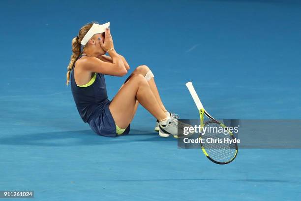 Caroline Wozniacki of Denmark reacts after winning championship point in her women's singles final against Simona Halep of Romania on day 13 of the...