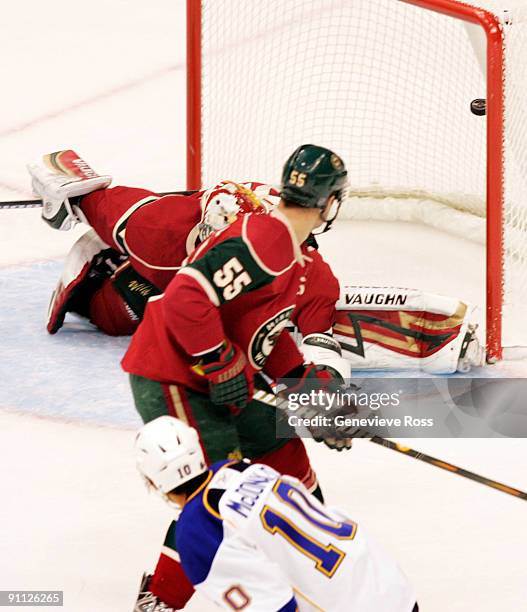 Andy McDonald scores against Nick Schultz and goalie Niklas Backstrom of the Minnesota Wild at the Xcel Energy Center on September 24, 2009 in St....