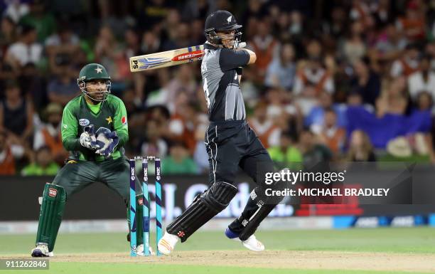 New Zealand's Anaru Kitchen bats watched by Pakistan's Sarfraz Ahmed during the third Twenty20 international cricket match between New Zealand and...