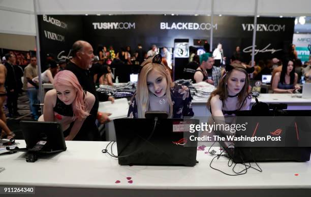 Cam models perform on the trade show floor during the AVN Adult Entertainment Expo at the Hard Rock Hotel & Casino on Jan. 25, 2018 in Las Vegas,...