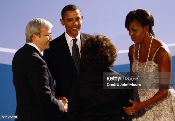 President Barack Obama and first lady Michelle Obama greet Australian Prime Minister Kevin Rudd and his wife Therese Rein at the Phipps Conservatory...