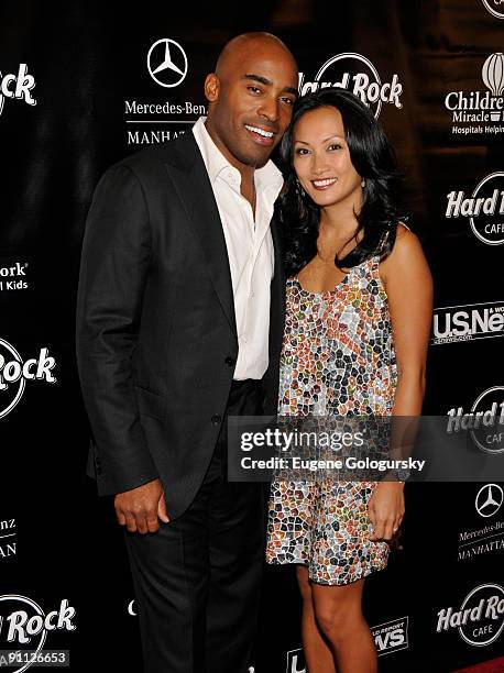 Tiki Barber and Ginny Barber attend the 3rd annual Tiki Rocks The Square for the Children's Miracle Network at the Hard Rock Cafe, Times Square on...