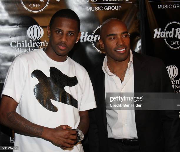 Rapper Fabolous and Tiki Barber attend the 3rd annual Tiki Rocks The Square for the Children's Miracle Network at the Hard Rock Cafe, Times Square on...