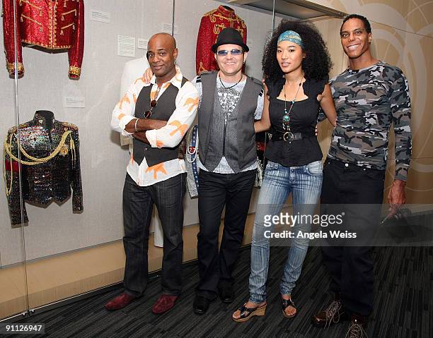 Michael Jackson backing vocalists Dorian Holley, Ken Stacey, Judith Hill and Darryl Phinnissee pose in front of Michael Jackson memorabilia at the...