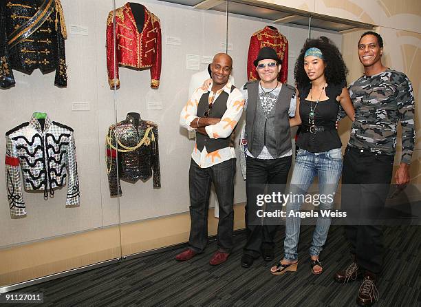 Michael Jackson backing vocalists Dorian Holley, Ken Stacey, Judith Hill and Darryl Phinnissee pose in front of Michael Jackson memorabilia at the...