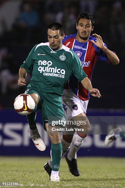 Diego Herder of Paraguay's Cerro Porteno vies for the ball with Felipe of Brazil's Goias during their Copa Sudamericana at the Pablo Rojas-Olla...