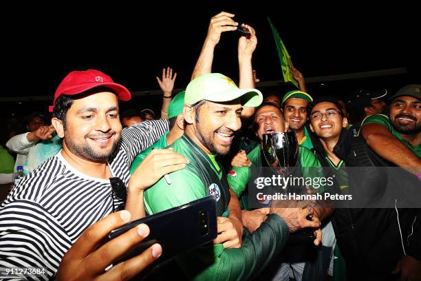 Sarfraz Ahmed of Pakistan celebrates with fans after winning game three of the International Twenty20 match between New Zealand and Pakistan at Bay...