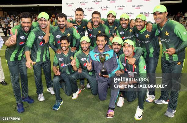 Pakistani players celebrate winning the series after the third Twenty20 international cricket match between New Zealand and Pakistan at Bay Oval in...