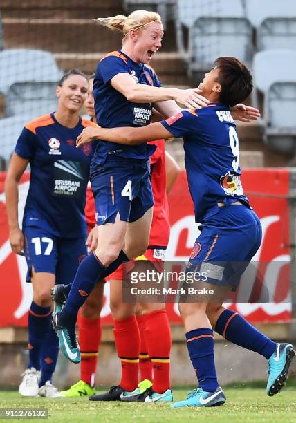 Clare Polkinghorne of Brisbane Roar celebrates a goal with Cheng Wai Ki of Brisbane Roar during the round 13 W-League match between Adelaide United...