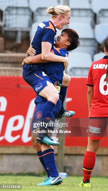 Clare Polkinghorne of Brisbane Roar celebrates a goal with Cheng Wai Ki of Brisbane Roar during the round 13 W-League match between Adelaide United...