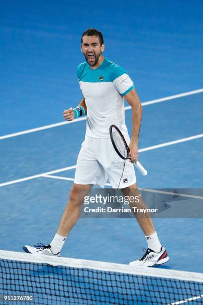 Marin Cilic of Croatia celebrates winning the second set in his men's singles final match against Roger Federer of Switzerland on day 14 of the 2018...
