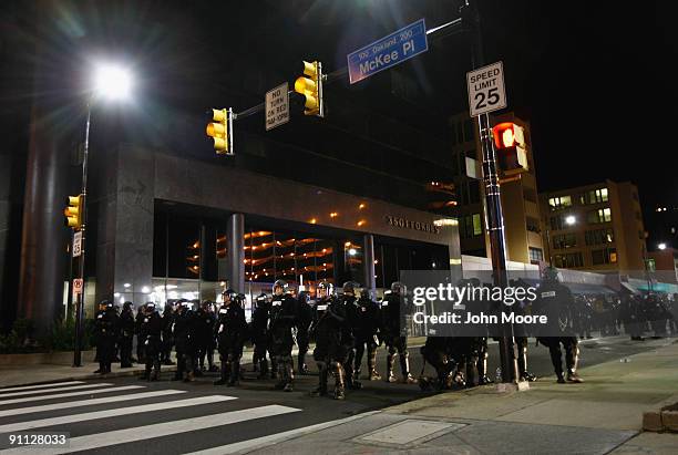 Riot policemen block off a street after breaking up a protest against the G-20 Summit early on September 25, 2009 in Pittsburgh, Pennsylvania. Riot...