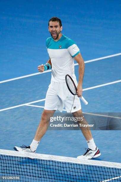 Marin Cilic of Croatia celebrates winning the second set in his men's singles final match against Roger Federer of Switzerland on day 14 of the 2018...