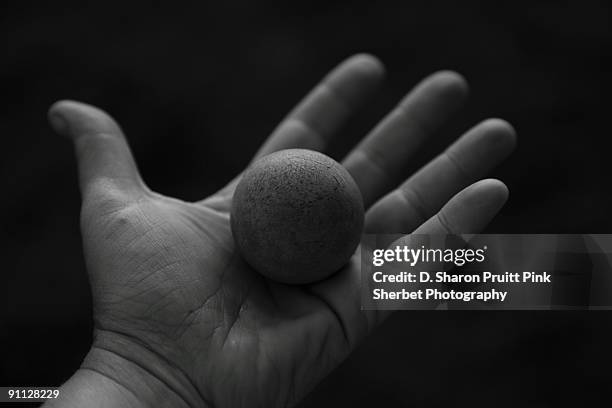 hand holding a rubber ball - sharon plain stock-fotos und bilder