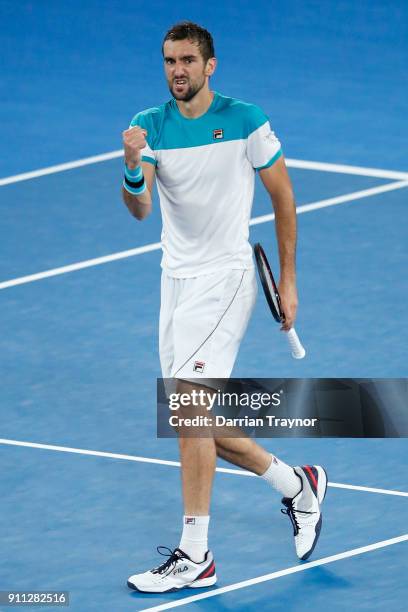 Marin Cilic of Croatia celebrates winning the second set in his men's singles final match against Roger Federer of Switzerland on day 14 of the 2018...