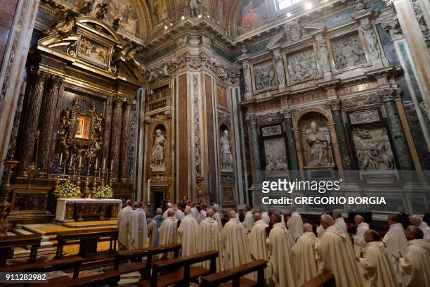 Pope Francis and prelates pray in front of the restored icon of Mary Salus Populi Romani at the end of a holy mass at St. Mary Major Basilica in...