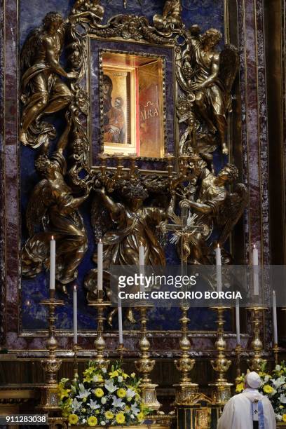 Pope Francis prays in front of the restored icon of Mary Salus Populi Romani at the end of a holy mass at St. Mary Major Basilica in Rome, on January...