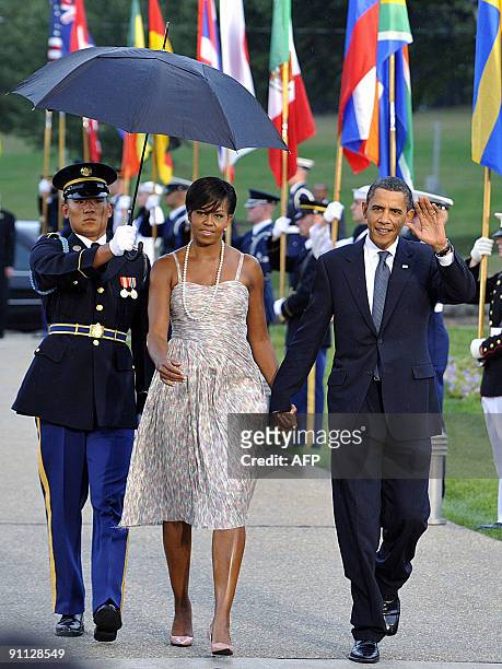 President Barack Obama and first lady Michelle Obama arrive at the Phipps Conservatory for an opening reception and working dinner for heads of...