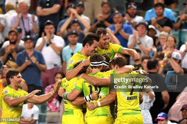 Australia celebrate victory after defeating South Africa in the MenÕs final match during day three of the 2018 Sydney Sevens at Allianz Stadium on...