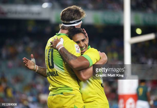 Ben O'Donnell of Australia celebrates with Maurice Longbottom after scoring a try in the Men's final match against South Africa during day three of...
