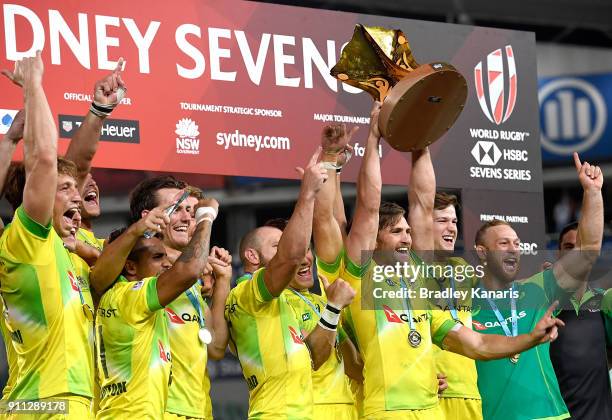 Australia celebrate victory after defeating South Africa in the MenÕs final match during day three of the 2018 Sydney Sevens at Allianz Stadium on...