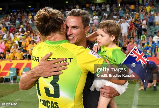 Tom Lucas of Australia embraces Ed Jenkins after defeating South Africa in the MenÕs final match during day three of the 2018 Sydney Sevens at...