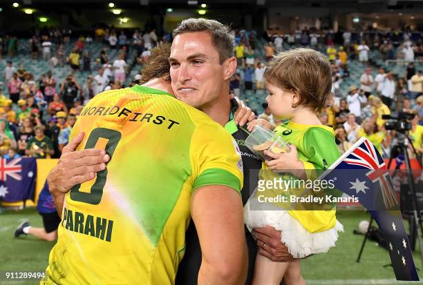 Jesse Parahi of Australia embraces Ed Jenkins after defeating South Africa in the MenÕs final match during day three of the 2018 Sydney Sevens at...