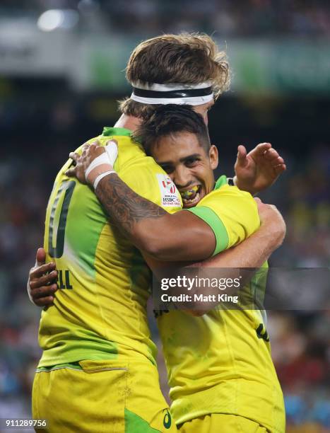 Ben O'Donnell of Australia celebrates with Maurice Longbottom after scoring a try in the Men's final match against South Africa during day three of...