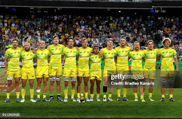 The Australian team embrace as they stand for their national anthem before the the MenÕs final match against South Africa during day three of the...