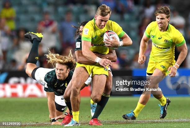 John Porch of Australia attempts to break away from the defence in the MenÕs final match against South Africa during day three of the 2018 Sydney...