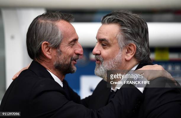 Paris Saint-Germain's assistant general manager Jean Claude Blanc speaks with Montpellier's French club president Laurent Nicollin during the French...