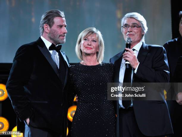 Actor John Travolta, Olivia Newton John and John Farrar speak onstage during the 2018 G'Day USA Black Tie Gala at InterContinental Los Angeles...