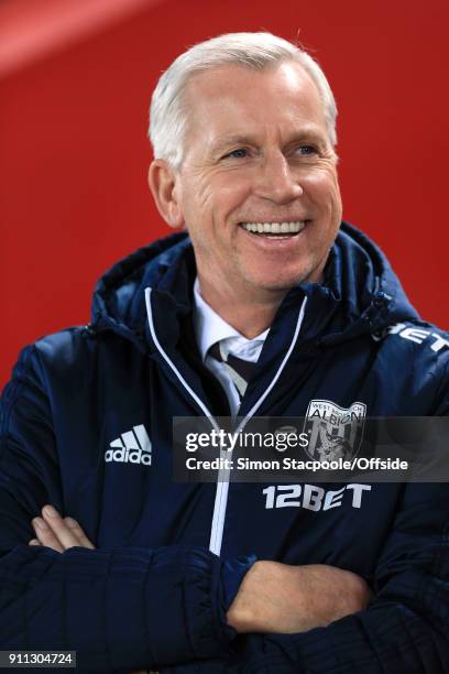 West Brom manager Alan Pardew laughs and smiles before The Emirates FA Cup Fourth Round match between Liverpool and West Bromwich Albion at Anfield...