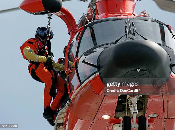 coast guard helicopter rescuer in san francisco - medevac stock pictures, royalty-free photos & images