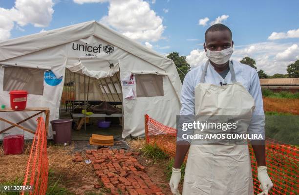 Medical personnel stands in front of a ward of a Cholera Treatment Centre, funded by the Unicef, Malawi Red Cross and UK Aid, at Bwaila Hospital in...