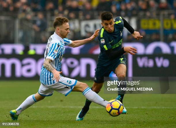 Spal's midfielder Manuel Lazzari vies with Inter Milan's Portuguese forward Joao Cancelo during the Italian Serie A football match Spal vs Inter...