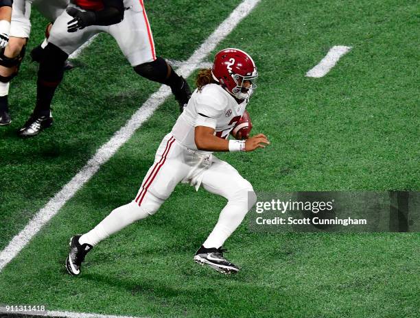 Jalen Hurts of the Alabama Crimson Tide scrambles against the Georgia Bulldogs in the CFP National Championship presented by AT&T at Mercedes-Benz...