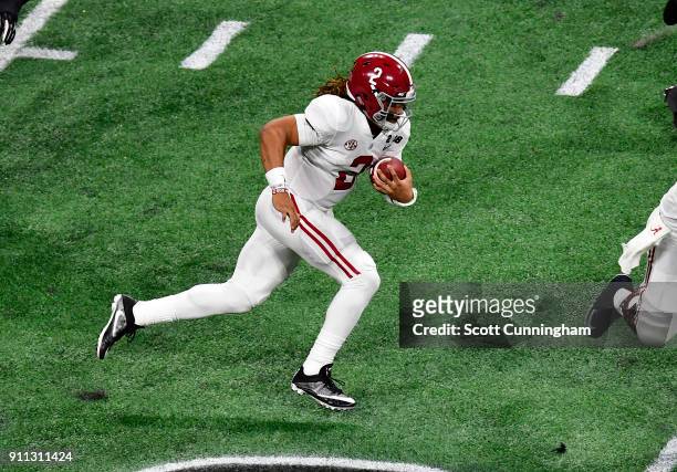 Jalen Hurts of the Alabama Crimson Tide scrambles against the Georgia Bulldogs in the CFP National Championship presented by AT&T at Mercedes-Benz...