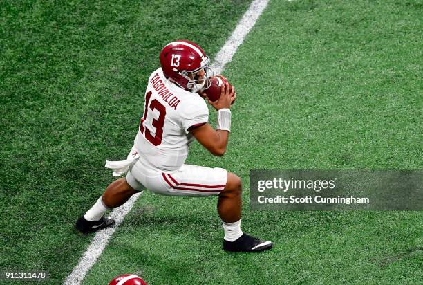 Tua Tagovailoa of the Alabama Crimson Tide passes against the Georgia Bulldogs in the CFP National Championship presented by AT&T at Mercedes-Benz...